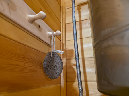 Sauna Accessories: Pumice Stone and Wooden Hooksの写真素材