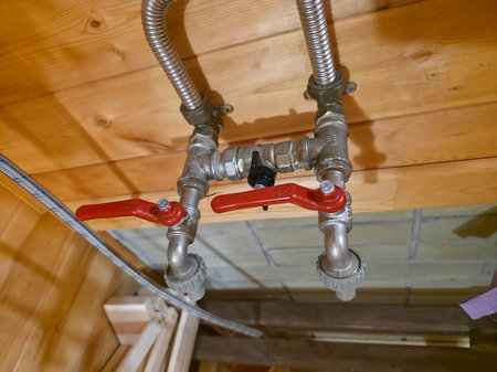 Water Supply System with Valves on Wooden Sauna Wallの写真素材