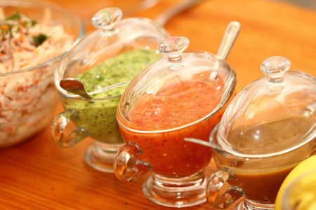 three types of sauce in glass sauce-boats