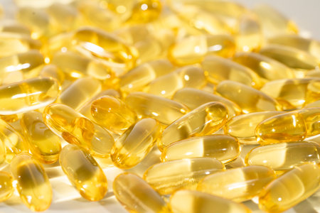 Food supplement oil filled fish oil, vitamin D, omega 3, omega 6, vitamin A, vitamin E, flaxseed oil.の写真素材