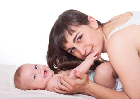 Cute happy family mother mum and baby boy girl on white backgroundの写真素材