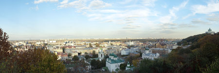 View to the oldest historic district Podol of capital city of Ukraine Kyiv. On background new...