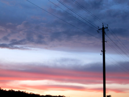 Power electric pole with line wire on colored background close up. Photography consisting of power...