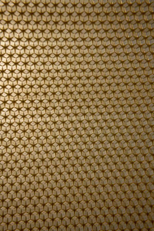 Abstract hexagon structure is honeycomb from bee hive filled with golden honey. Honeycomb summer composition consisting of gooey honey from bee village. Honey rural of bees honeycombs to countryside.の写真素材