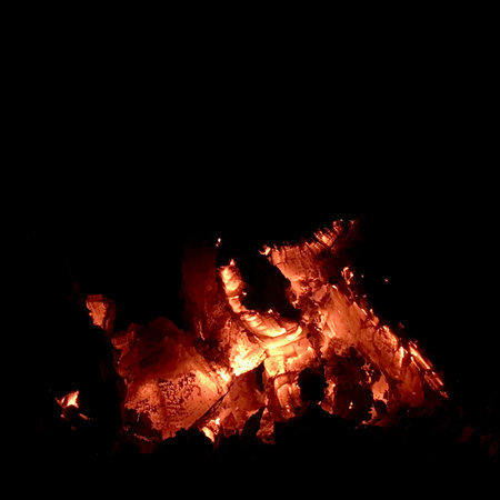 Beautiful flame brown wood dark black coal on bright yellow fire inside metal brazier. Flame burning...