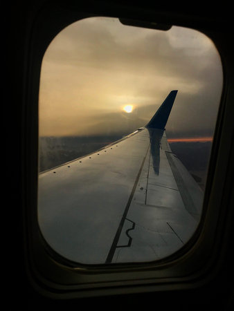 Beautiful view from airplane window, large wing of aircraft shows casement. Windows aircraft show...