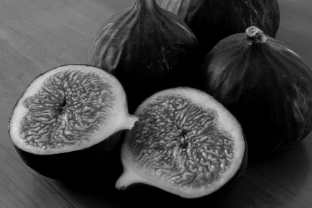Photography to theme beautiful sweet purple fruit fig on wooden table background. Photo consisting of composition tasty purple sweet fruit fig. Design sweet purple fruit fig from natural vitaminsの写真素材