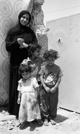Iraq, Baghdad - 2 May 2005 Different muslim people handles personal affairs after conflict with military during curfews. Muslim people is traditional ethnic cultural. foreign muslim religious people.のeditorial素材