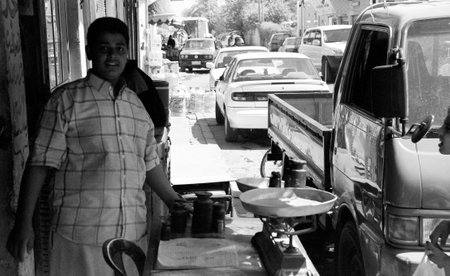 Iraq, Baghdad - 2 May 2005 Different muslim people handles personal affairs after conflict with military during curfews. Muslim people is traditional ethnic cultural. foreign muslim religious people.のeditorial素材