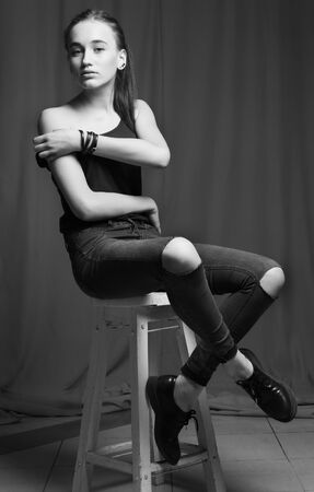 Sexy female model posing in fashion dress, black and white photo, colorless.の写真素材