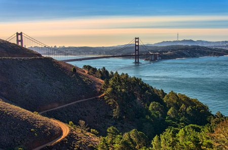 Panorama of the Golden Gate bridge at sunset with the Marin Headlands in the foreground, San...