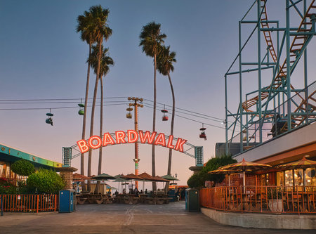 Beach boardwalk with an amusement park taken in Santa Cruz, CA
