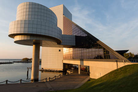 The Rock and Roll Hall of Fame and Museum in Cleveland Ohio USA seen during the sunset. Steamship William G Mather Maritime Museum on the left.のeditorial素材