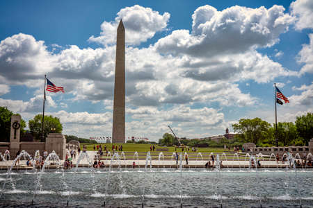 fountain at the World War II memorial with the Washington Monument in the background in the National Mall in Washington D.C.のeditorial素材