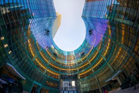 The iconic circular shape of the residences at the Bloomberg Tower, One Beacon Court, cites design...