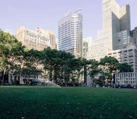 View of the green Brynat park with office buildings as backgroundのeditorial素材