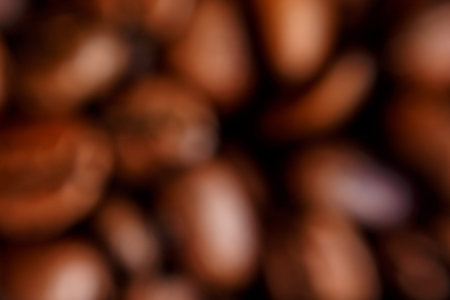 blurred loose large coffee beans. high quality photo