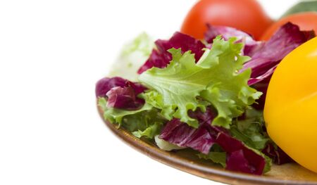 vegetable salad on plate. white backgroundの写真素材