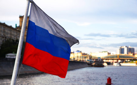 Russian flag on the background of Moscow city and the Riverの写真素材