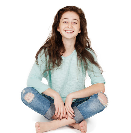 cheerful cute teen girl 17-18 years, isolated on a white backgroundの写真素材
