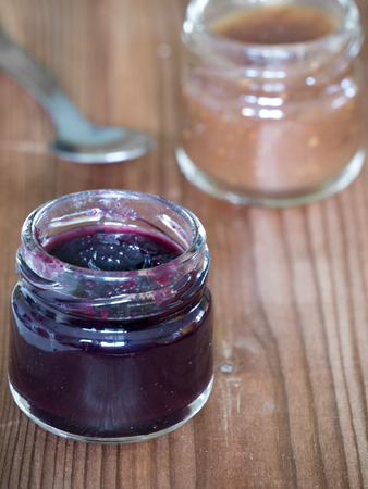 Jars of jam of two different flavors close upの写真素材