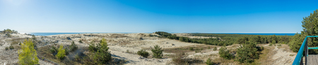 Panorama of sandy dunes and blue sky in the spring morning. Efa Height, Curonian Spit National Park, Russia.の写真素材