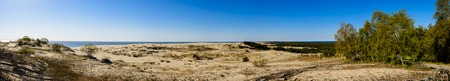 Panorama of sandy dunes and blue sky in the spring morning. Efa Height, Curonian Spit National Park, Russia.の写真素材