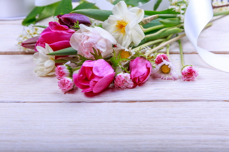 Festive flower composition on the white wooden background. Overhead view.の写真素材