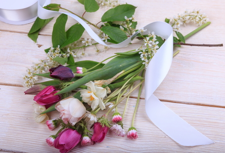 Festive flower composition on the white wooden background. Overhead view.の写真素材
