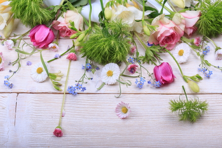 Festive flower composition on the white wooden background. Overhead view.の写真素材