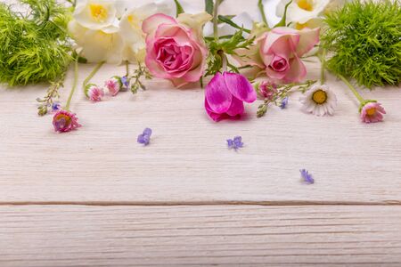 Festive flower composition on the white wooden background. Overhead view.の写真素材