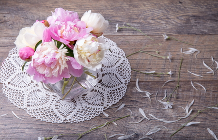 Stunning pink and white peonies on rustic wooden background. Copy space. Mothers, Valentines, Womens Wedding Day conceptの写真素材