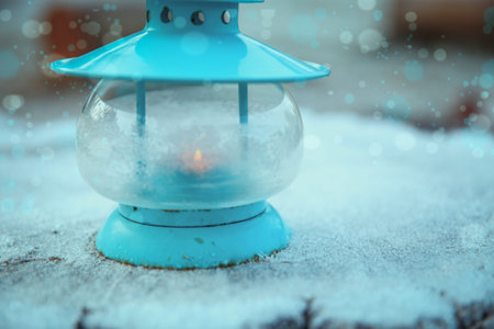 Christmas decoration with lantern and snow. Winter background.