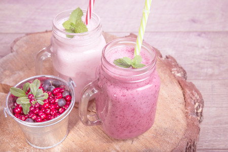 Assorted fruit or berry shakes on white table. Smoothie conceptの写真素材