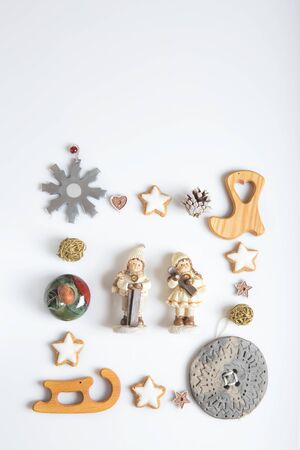 Christmas composition. Gift, christmas, new year decorations, snowflakes, stars, figures, pine cones. Flat lay, top viewの写真素材