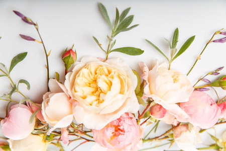 Festive flower composition on the white wooden background. Overhead viewの写真素材