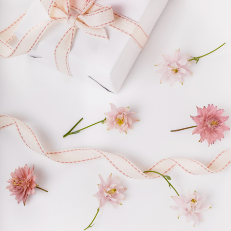 Festive flower composition on the white wooden background. Overhの写真素材