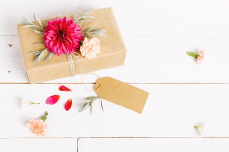 Festive flower composition on the white wooden background. Overhead viewの写真素材