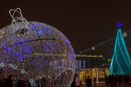 Minsk, Belarus - December 30, 2018: Christmas tree, illuminations and decorations in front of building of the Palace of Republic in Oktyabrskaya Square.のeditorial素材