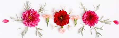 Beautiful Floral top border. Floral arrangement of violet and orange flowers on isolated white background for design.の写真素材