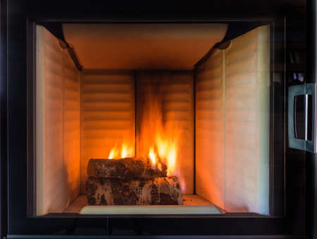 Burning fireplace. Fireplace as a piece of furnitureの写真素材