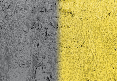 The trendy colors of 2021 year are gray and yellow. Textured old plaster on the wall painted in two colorsの写真素材