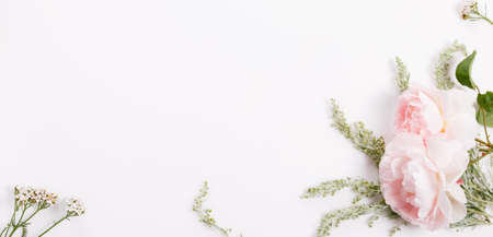 Flowers composition. Frame made of pink rose flowers on white background. Flat lay, top viewの写真素材