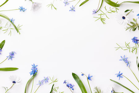 Spring frame of small flowers and daisy, floral arrangement
