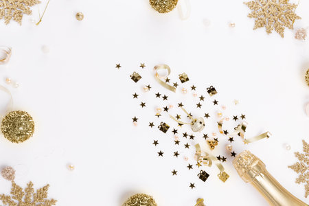 Celebrating new year, anniversary, festive composition with champagne on a white backgroundの写真素材