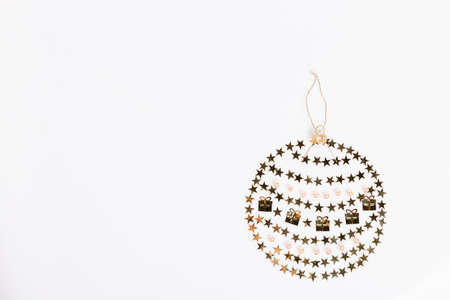 Christmas toy made of sparkles and confetti. Minimalistic Christmas composition for your advertisement, flat layの写真素材