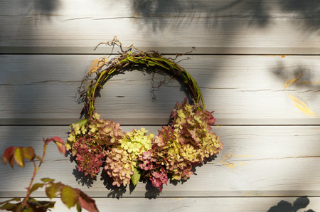 Country house decorated with autumn wreathの写真素材