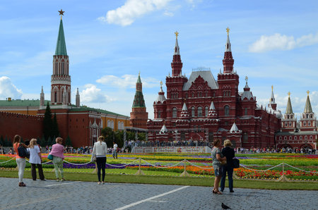 MOSCOW, RUSSIA - JULY 18, 2013  People walk along Red Square on the anniversary day of GUM  