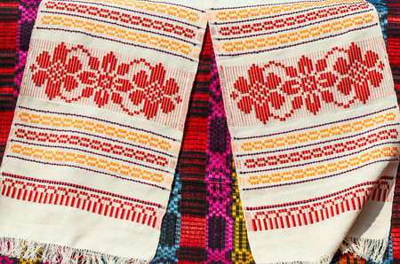 Belorussian towels with traditional ornaments on the background a bright colored rustic bedcoverの写真素材