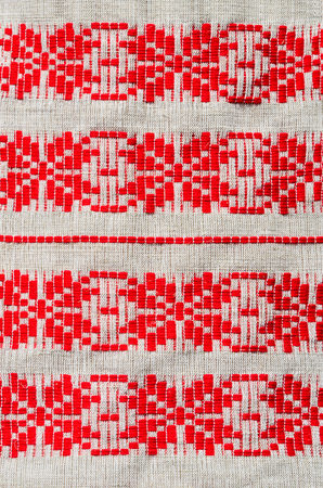 Traditional red rustic ornament on Belorussian towels of coarse clothの写真素材